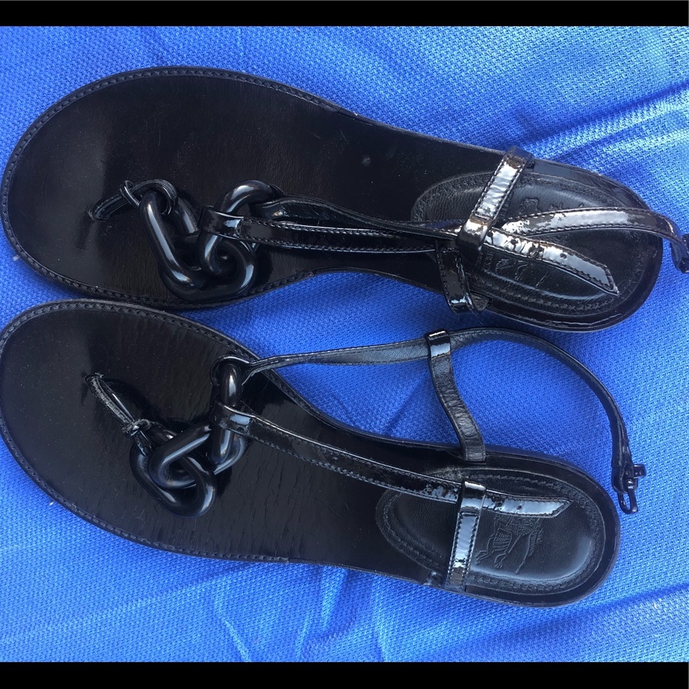 Burberry flat sandals.